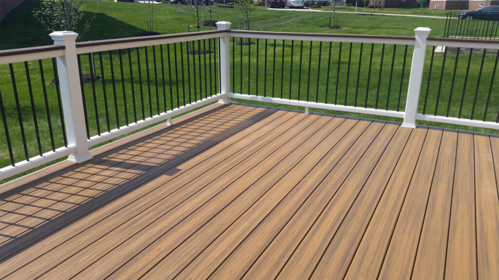 Trex Decking with a white rail installed by Sunburst Construction after deck design and installation