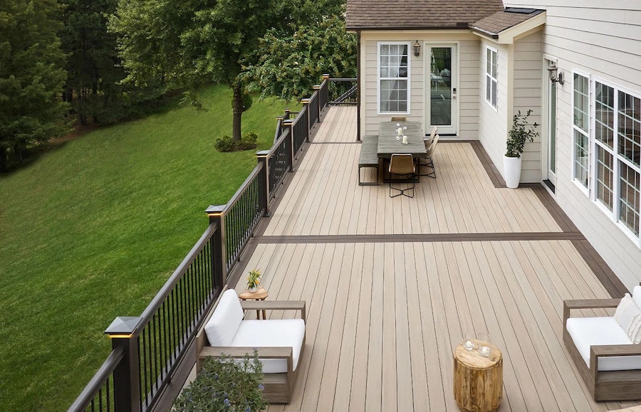TimberTech composite deck with picture-frame border and modern outdoor furniture